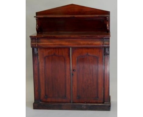 A Victorian mahogany chiffonier, the arched raised back, with a shelf on 'S' shaped supports, the base with a shaped drawer, 