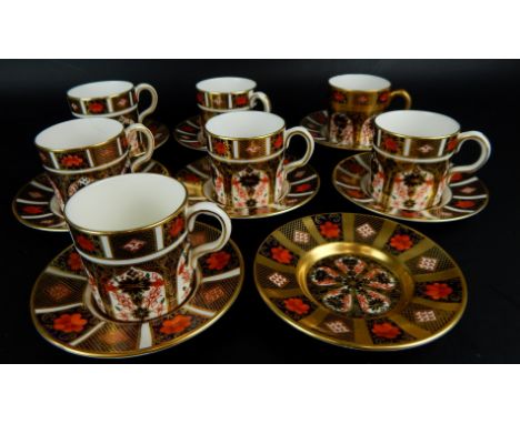 A matched set of seven Royal Crown Derby coffee cans and saucers, and an additional saucer