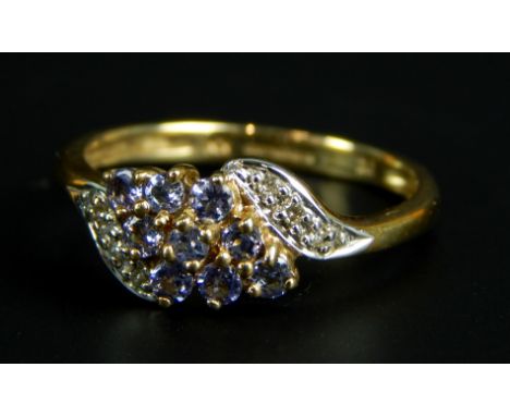 A 9ct gold dress ring, set with tanzanite and diamonds , 1.9g all in. 