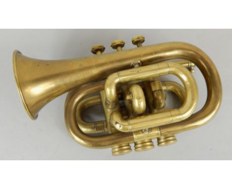 A brass cornet, lacking mouthpiece, and fitted case, 21cm long.