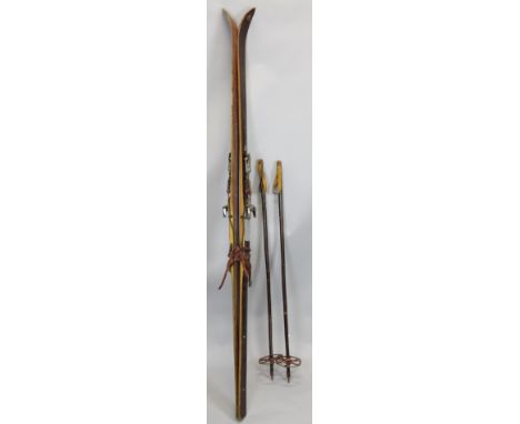 A pair of Haggen vintage skis and wooden ski poles