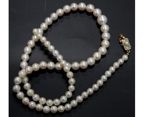 A cultured pearl necklace, with yellow metal clasp, in the Art Deco style, unmarked, (AF). 