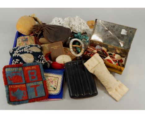 Miscellaneous textile items, to include various Victorian pin cushions, items of embroidery, enamel buckle, beads, buttons, q