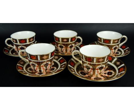 An associated set of Royal Crown Derby Old Imari pattern cups and saucers, to include five matching cups, and a set of four p
