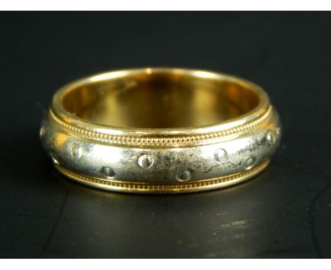 A 9ct gold dress ring, with bi-colour design and floral engraving, 5.7g all in. 