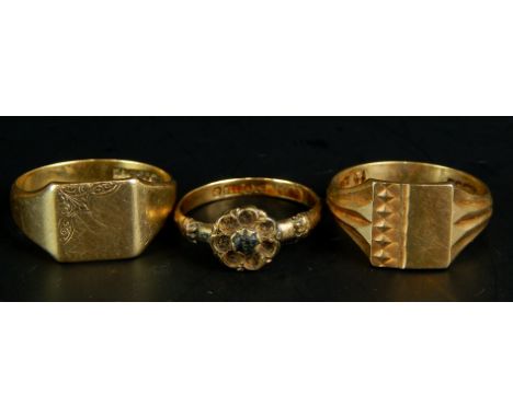 Three 9ct gold rings, to include two signet rings, and a dress ring with centre red stone, lacking surrounding stones, 9.1g a