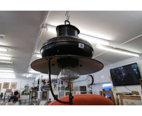 AN OLD HANGING OIL LAMP