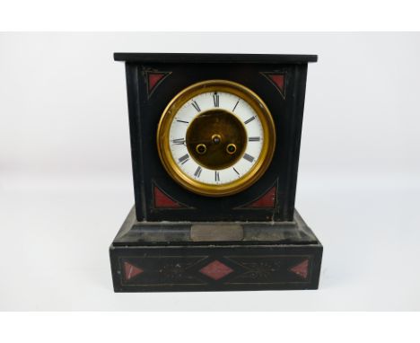 A Victorian black slate and red marble mantel clock, Roman numerals to a white chapter ring, white metal presentation plaque,