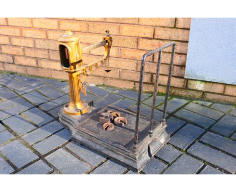 A vintage set of W & T Avery scales, with weights. [W]