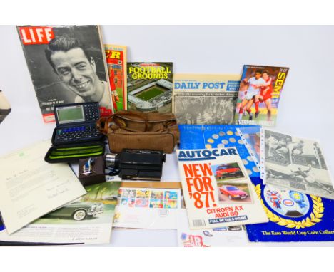 A mixed lot to include film camera, Casio electronic diary, football programmes and ephemera, World Cup Coin Collections, fir