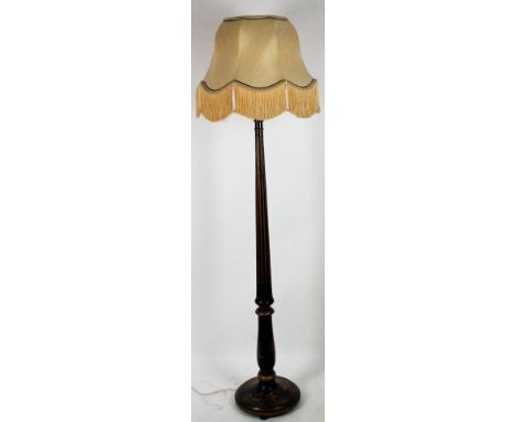A polychrome chinoiserie on black lacquer standard lamp, with shade.