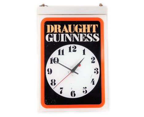 A 20thC vintage Draught Guinness advertising wall clock, in red, black and white, 42cm W, 28cm H.. 