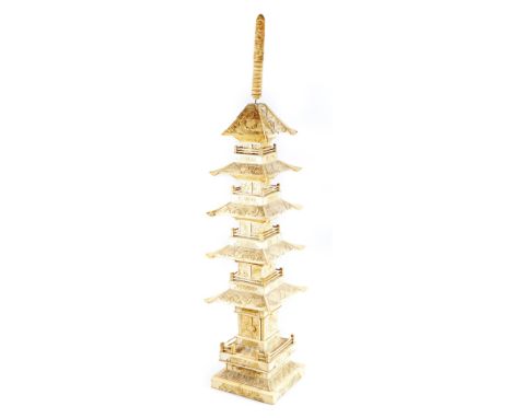 A 19thC Chinese bone and ivory model of a pagoda, in six sections, elegantly carved with a repeat design, 75cm H.