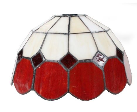 *An as new light fitting, with Tiffany design shade predominately in cream and orange, 25cm W.