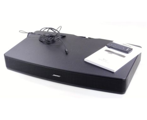 A Bose Solo television sound system, 51cm wide, with remote control and instruction manual. 