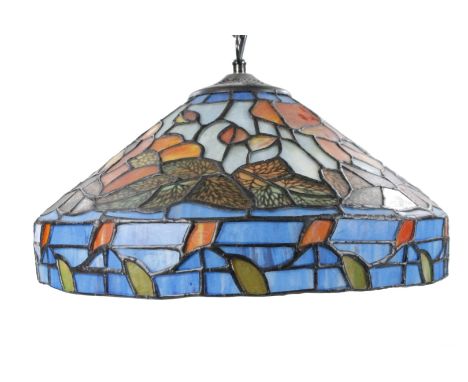 *An as new light fitting, with Tiffany style shade decorated with flowers predominately in orange and green, 35cm Dia.