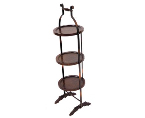 An early 20thC oak three tier cake stand, with metal sections and turned handle, on shaped feet, (when closed) 94cm H, 32cm W