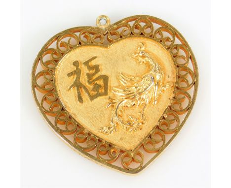 A Chinese heart shaped pendant, the central heart shape with figure of a bird and Chinese writing, with scroll design border,