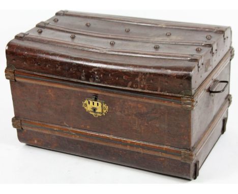 An early 20thC tin trunk, of rectangular form with a beaded lid and plain interior, 44cm H, 74cm W, 51cm D.