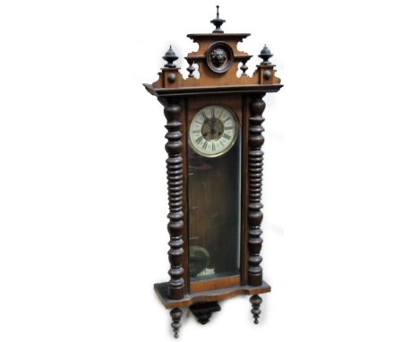 A 19thC walnut Vienna wall clock, the 17cm Dia. Roman numeric dial fronting an eight day keywind movement, in a three part gl