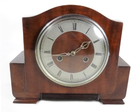 A 1950s walnut cased 8-day mantel clock, the 14cm Dia. Roman numeric dial with two winding holes revealing a keywind movement
