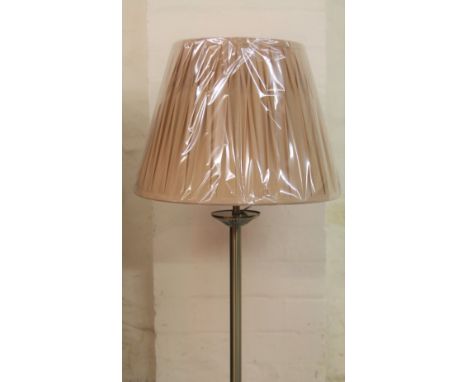 *An as new electrical standard lamp, with cylindrical stem on circular foot with textured shade, 161cm H.