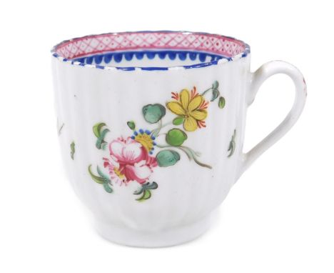 An 18thC New Hall porcelain fluted coffee cup, c.1785, decorated with floral sprays with a blue and puce border, 6cm H, unmar