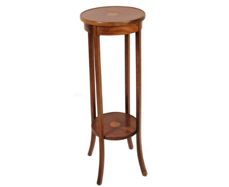 An Edwardian mahogany plant stand, the circular top on sabre legs, with sun inlay and further shelf beneath, 102cm H, 35cm Di