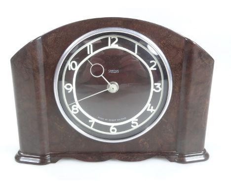 A mid 20thC Smith's Bakelite cased mantel clock, the 10cm Dia. Arabic dial with a chrome plated bezel, 15cm H.