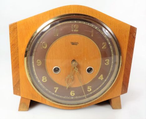 A vintage Smith's Enfield mantel clock, with 14cm Dia. dial, 8 day strike on gong keywind movement with pendulum, 20cm H.From