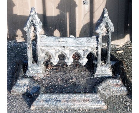 A Victorian cast iron boot scraper, with shaped Gothic centre and inverted rectangular base, 35cm H, 42cm W, 36cm D. From the