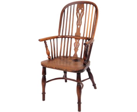 A early 19thC Lincolnshire high back yew and elm Windsor chair, with pierced splat, C shaped arms, single moulded forelegs an
