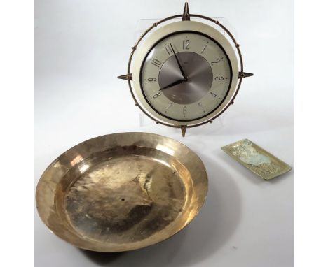A Metamec vintage wall clock, with 16cm Dia. Arabic dial, with a NATO stylised casing, a brass plate and an ashtray. (3)From 