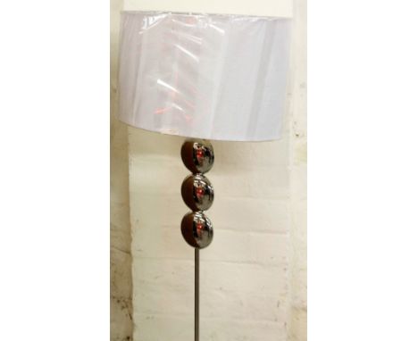 *An as new electrical standard lamp, with shaped stem on circular foot, with textured oval shade in white, 164cm H.