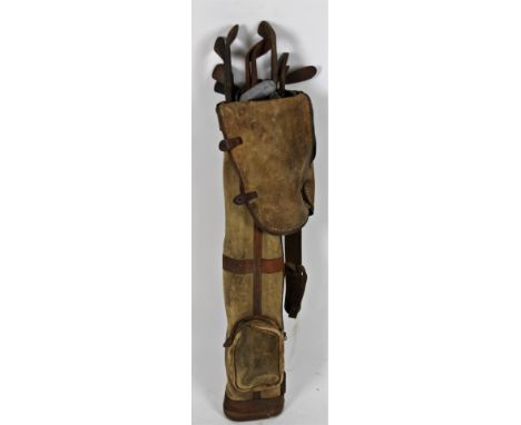 A set of vintage golf clubs, with iron heads, with bag. (a quantity, various dimensions)