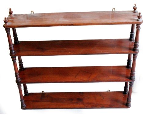 A Victorian mahogany hanging shelf, with four shelves broken by cylindrical supports, supported by urn finials, 79cm H, 85cm 