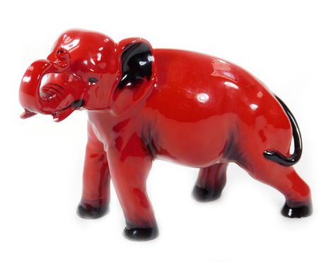 A Royal Doulton flambé elephant, with trunk raised, printed mark, 15cm H.