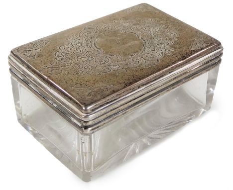 A Victorian silver topped glass box, of rectangular form with a removable lid, partially chased with scrolls and flowers, Lon