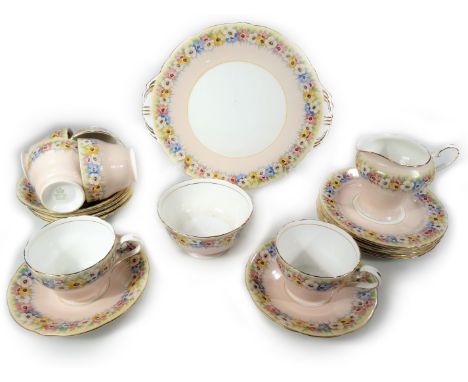 A 20thC Aynsley part tea service, polychrome decorated with pansies, comprising of a milk jug 12cm H, serving plate, sugar bo