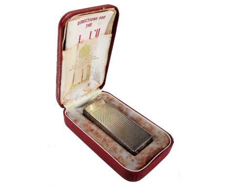 A mid 20thC Dunhill pocket lighter, of rectangular form partially engine turned, 6.5cm H, in fitted box with paperwork and ou