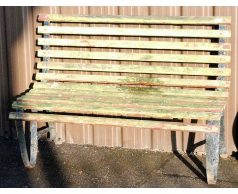 A cast metal and slatted wooden garden bench, with shaped legs, 90cm H, 123cm W, 72cm D. From the estate of R J 'Bob' Curry (
