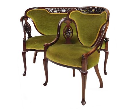 A late 19thC mahogany show framed salon suite, comprising of a two seater settee and armchair, each with pierced oval splats,