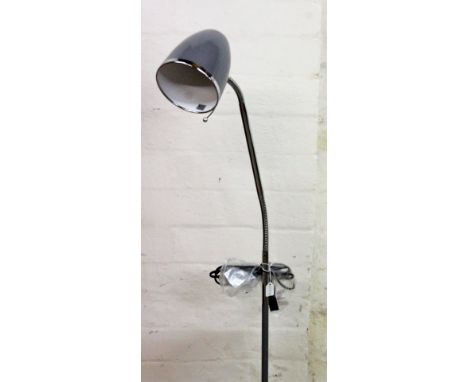 *An as new electrical adjustable standard lamp, with bike light head, shaped chrome coloured stem and circular foot, 157cm H.