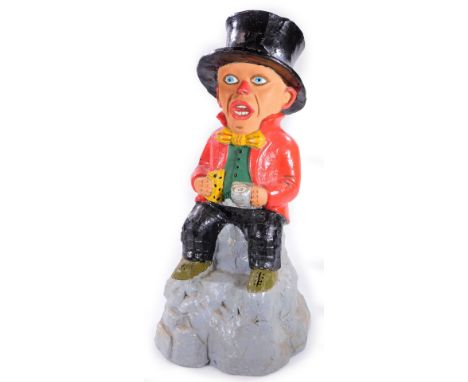 A hollow metal figure, of a gentleman in red jacket, with black top hat and black trousers, holding jug, 45cm H. 