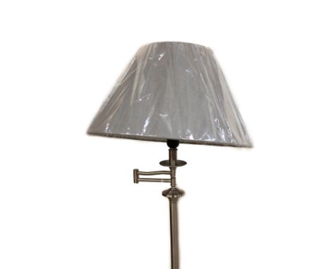 *An as new electrical standard lamp, on cylindrical stem and stepped foot, with material shade, 158cm H.