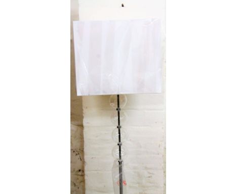 *An as new electrical standard lamp, on orb and cylindrical stem terminating in square foot, with square shade, 145cm H, with