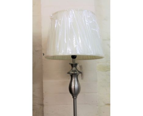 *An as new electrical Minster standard lamp, with shaped cylindrical stem on circular foot, with textured shade, 165cm H.