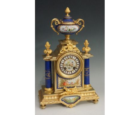 A good mid 19th Century ormolu mounted porcelain mantel clock, the top with porcelain finial with ormolu foliate knop and pai