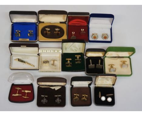 A bag of cufflinks, mostly gold tone geometric styles, one mother of pearl an silver coloured pair, another pair with engrave