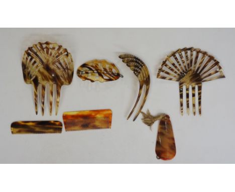 A selection of faux tortoiseshell items to include: two geometric design mantilla or hair combs; a similar smaller hair comb 